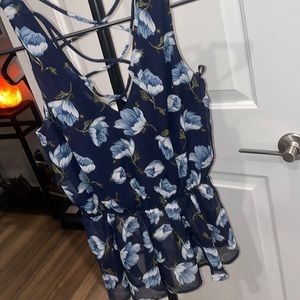 Blue floral tank with a deep v in the back size small NWT